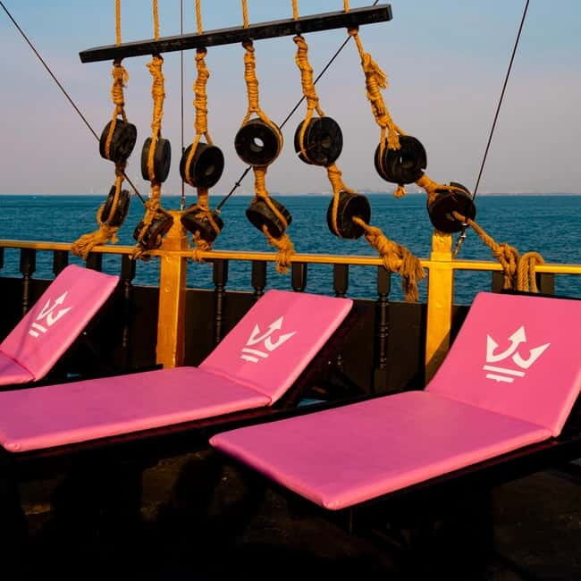 Pattaya: Koh Larn Pirate Cruise with Transfer & Activities - First island stop vibe: fishing, beach time, and photo moments